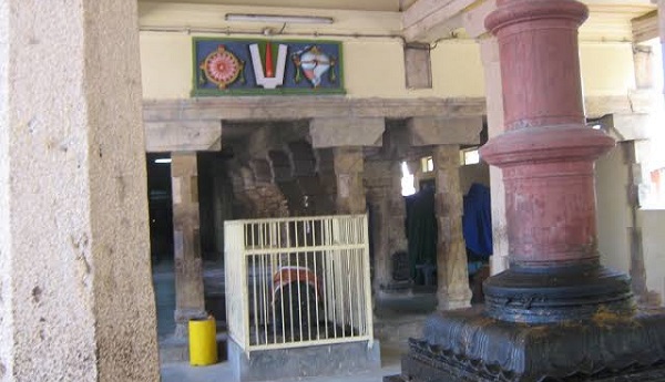 A view of kaaisinavendhan temple interior with flagstaff erected in the front pavilion