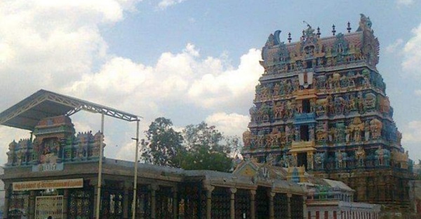 A view of the stone mandapams leading to the Palayamkottai Gopalan temple's main entrance with the magnificent gopuram in the background.