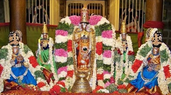 Thenthirperai Divya Desam Temple God with his wives adorned with jewellery, flowers and accessories.