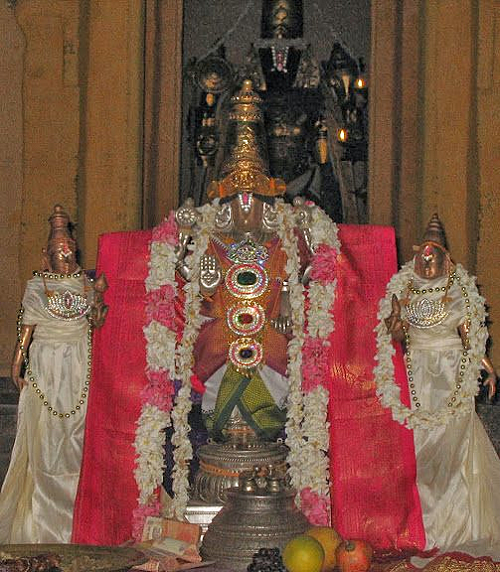 Thirukulanthai god decked with ornaments and flowers in Mayakoothan Thirukulanthai Perumal Temple