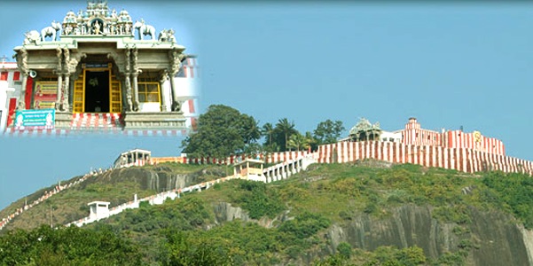 View of the Thirumalai hill, the Thirumalai Kumarasamy temple's white and red walls, the trees, and an inset picture of the Thirumalai kovils main entrance. 