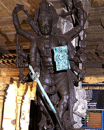 Portray of world famous Agni and Agora Veerabadhra stone carving gigantic sculpture with multiple hands holding several weapons in Tenkasi Ulagammai Kasi Viswanathar Temple