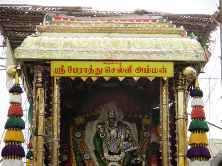 Perthu selvi amman temple in a well decorated temple car.