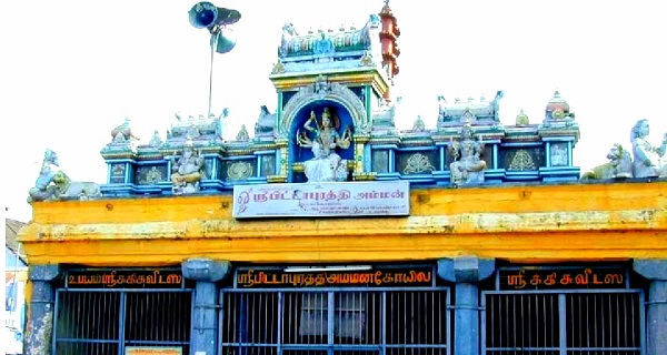 Pittapurathi amman temple main entrance in tirunelveli depicts Lord Ganesha and other Gods in the foreview with the temple's flag mast in the background.