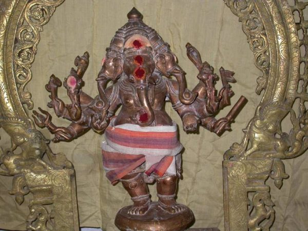 Copper statue of lord ganesh decorated with dhoti.