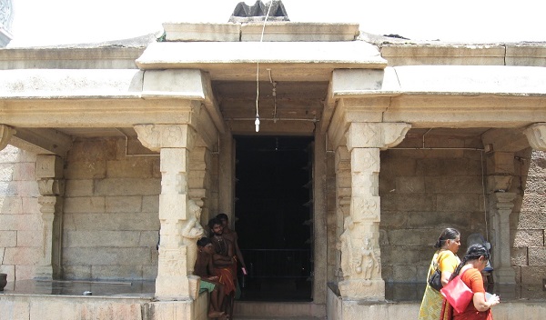 Devotees seen walking by the front entrance of the Thiruvenkadar Sivan temple