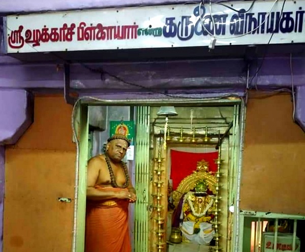 A priest awaiting to perfrom rituals for karunai vinayagar.