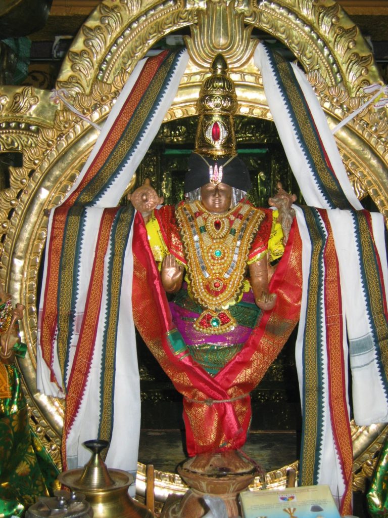 Idol of chakkarathalvar decorated with pattu dhoti and ornaments in Karisoozhndamangalam Venkatachalapathy Kovil Tirunelveli