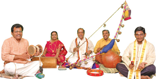 A group of folk artistes performing villuppattu with villu, udukku, villukottai & kattai, harmonium and talam
