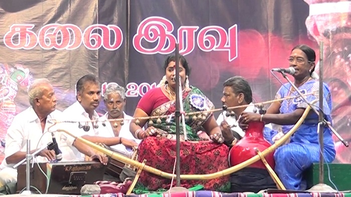 Villuppattu folk artistes with their instruments performing on a stage