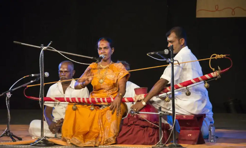 Foll artistes performing villuppattu using villu, villu kottai and talam