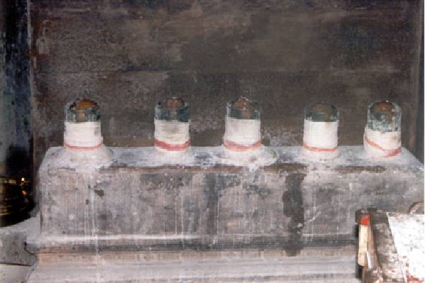 Five lingams adorned with white dhoti.