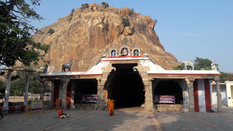 Few devotees are seen in front of the beautiful hill view of the majestic SriKazhugachalamurthi temple