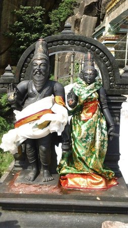 Agathiyar munivar with his wife decked up in dhoti and saree.