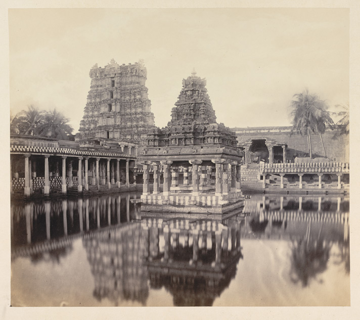An old black and white picture of theppakullam with water.