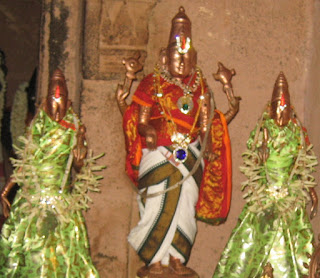 Veeravanallur Sundarraja Perumal with his two wives at Veeravanallur Perumal Temple decorated with jewels and flowers.